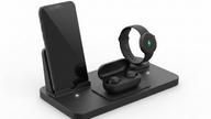 3-in-1 wireless charging station with smartphone, smart watch, and earbuds on a sleek gray base